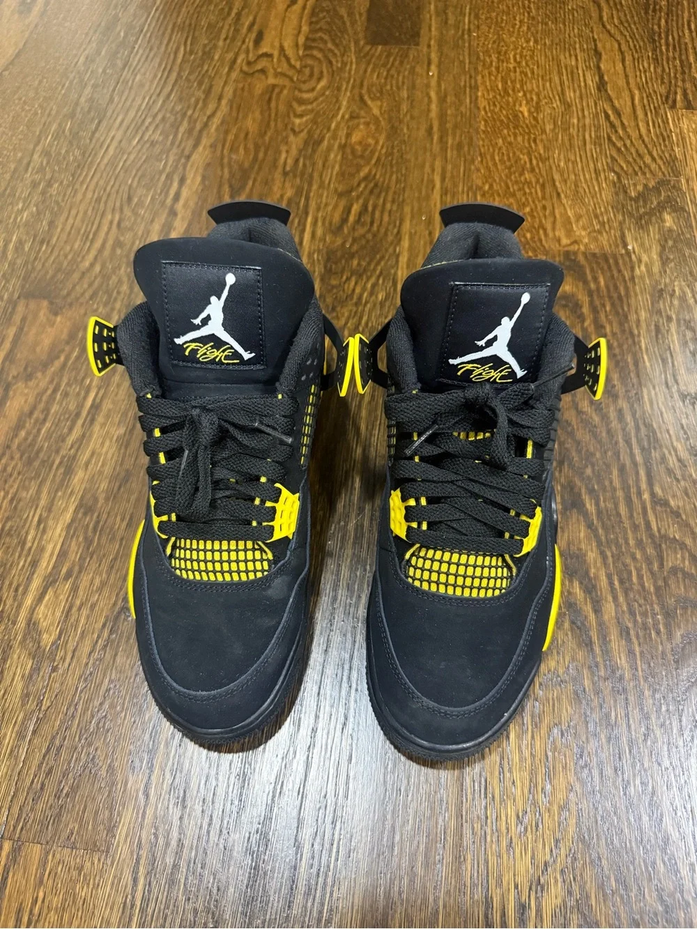 Jordan 4 Retro Black and Yellow “Thunder” Sneakers